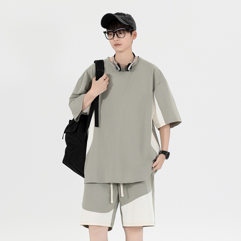 Tren de moda de verano Traje de ocio deportivo juvenil para hombres Pantalones cortos sueltos de manga corta de gran tamaño Hermoso traje de dos piezas para hombres