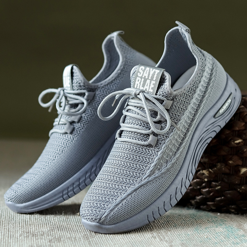 Zapatos de los hombres nueva primavera 2023 Comercio exterior transfronterizo zapatos de los hombres volando tejido con cordones casual jogging al por mayor zapatilla de deporte de los hombres