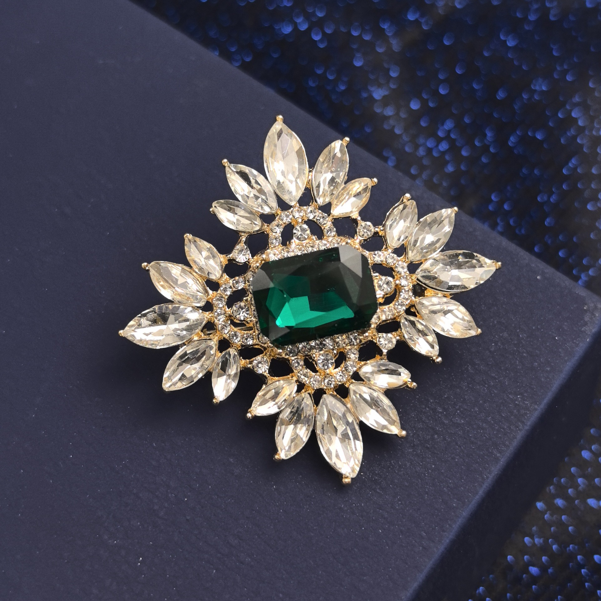 Geometric brooch with tassels