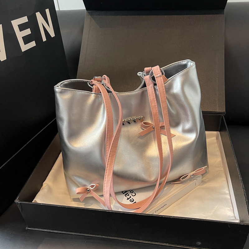 Este año popular bolso de viaje de moda coreana, bolso de hombro de estilo de ballet de mujer, textura alta, arco, bolso de mano.