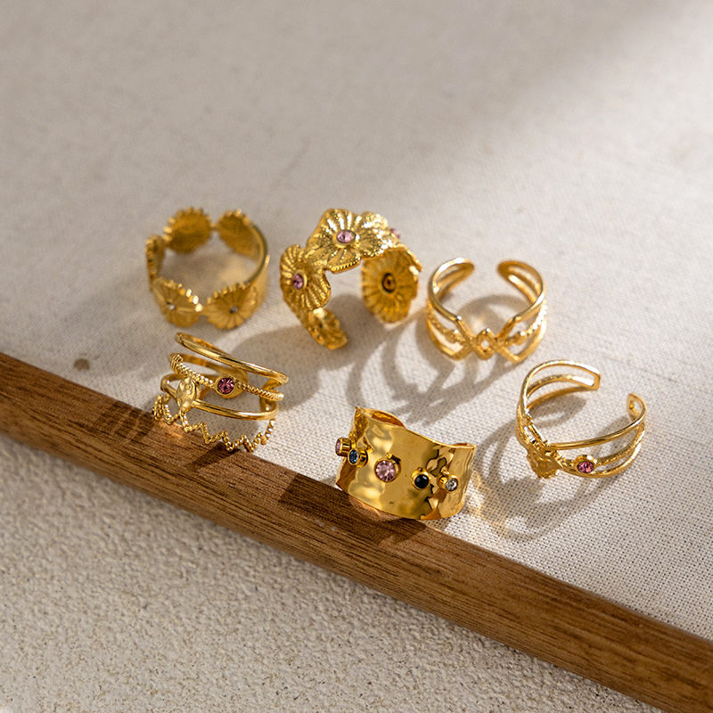 TENA oro de 18k acero inoxidable hueco anillo de zircón de alta calidad anillo de titanio diseñado por mujeres de nicho en el viento