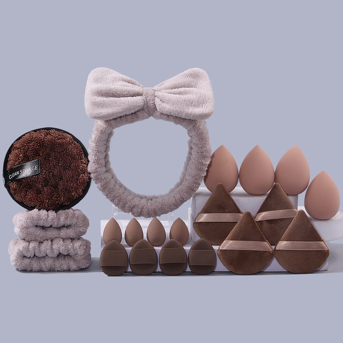 Explosiones transfronterizas desmaquillaje triángulo pulgar polvo conjunto correa de cabello combinación de huevo de maquillaje lavado de la cara esponja absorción correa de muñeca