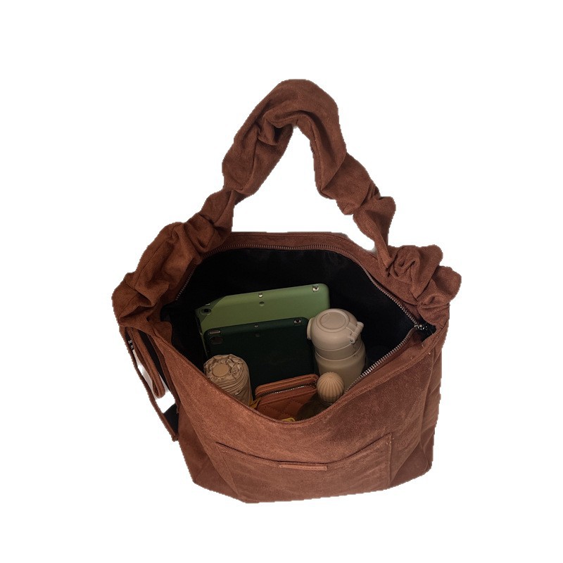 2025 otoño y invierno retro gaúster bolsas de balde de agua de mujer ocio versátil bolsas tote de gran capacidad plegadas mochila de hombro