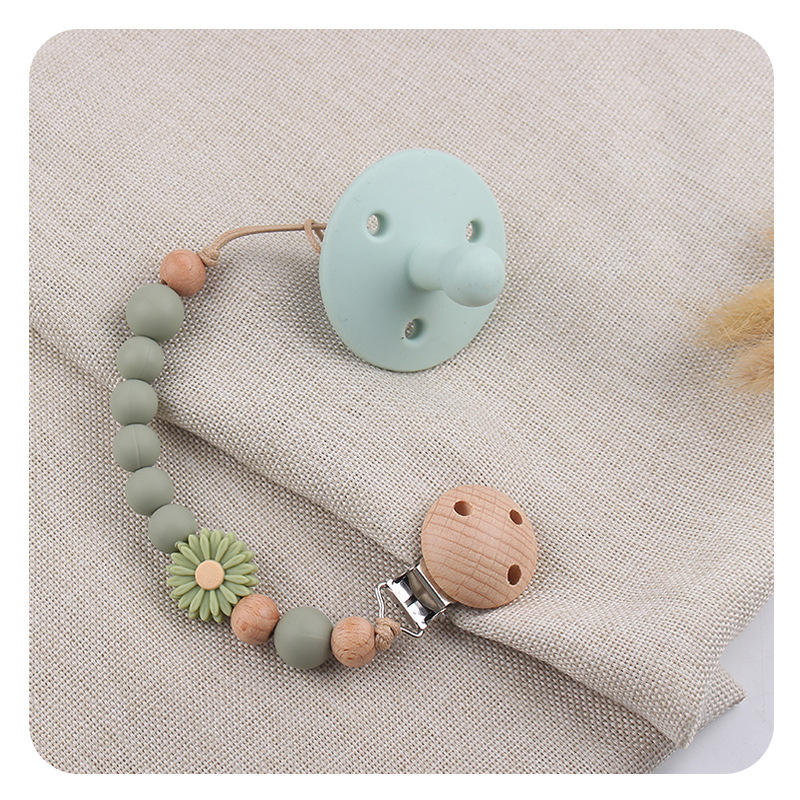 Productos para bebés de madera de haya cadena de tetas de silicona de dibujos animados margarita cuentas para calmar bebés cadena de tetas anti-caída cadena