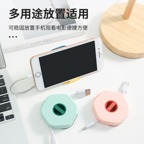 A variety of data cable storage boxes, mobile phone charging cable winders with mobile phone holders, portable headphone storage boxes