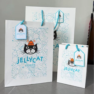 Подарочный пакет Jellycat с синим принтом и завязками белый картон