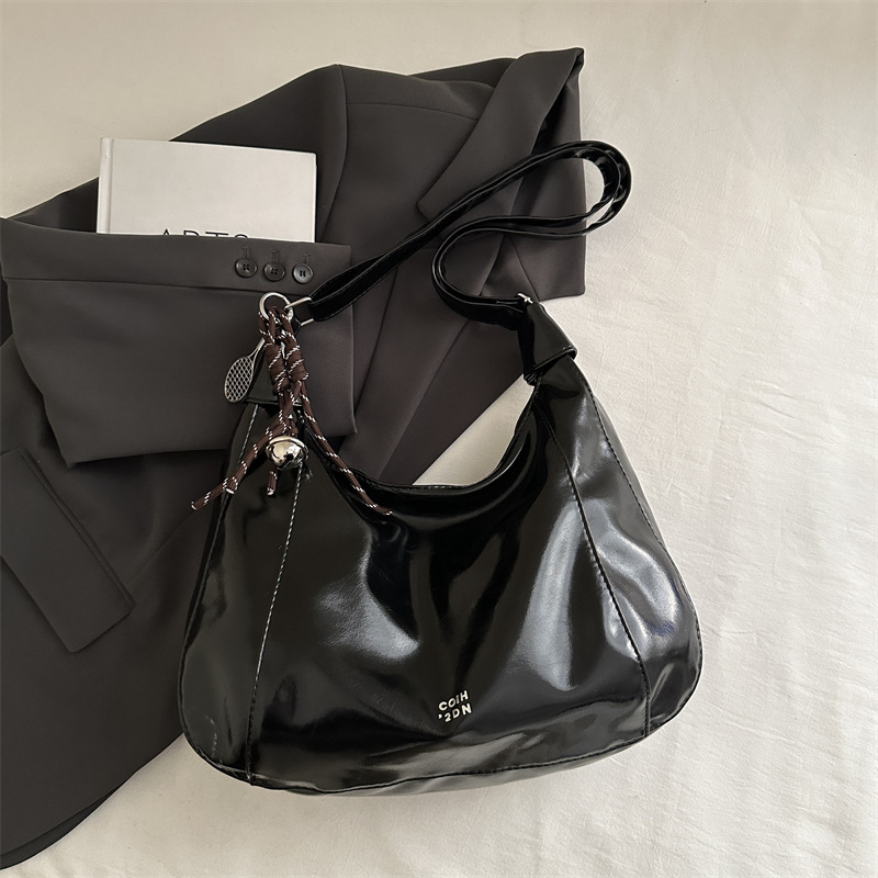 Bolsa de viaje casual de gran capacidad para mujeres 2025 primavera y verano nueva moda versátil hombro de hombro con una sensación relajada bolso