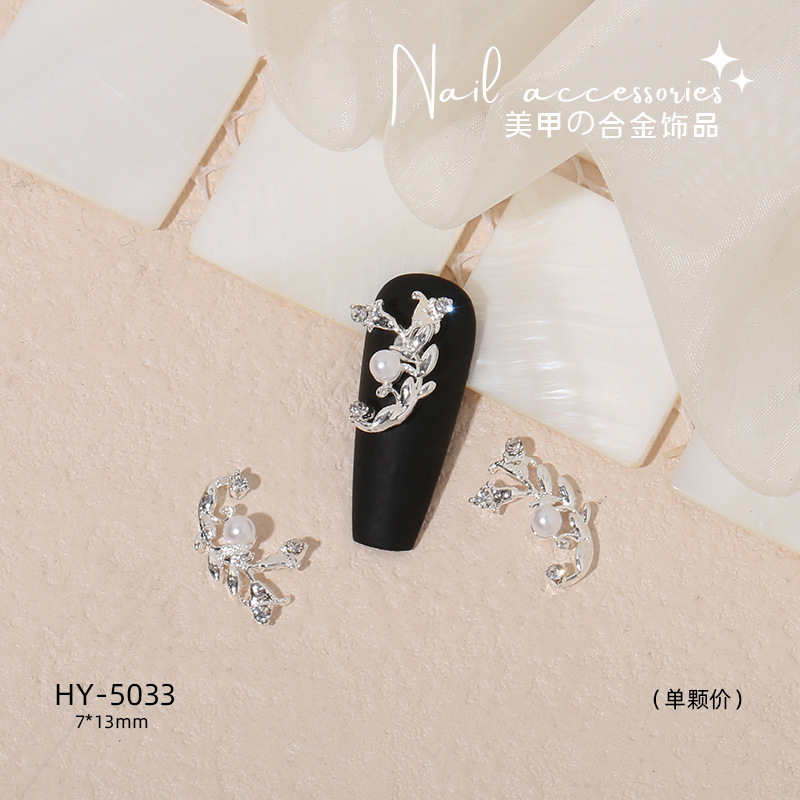 Nuevo arco de uñas amor aleación decoración de uñas flor de la luna mariposa clavo taladro fábrica joyería al por mayor