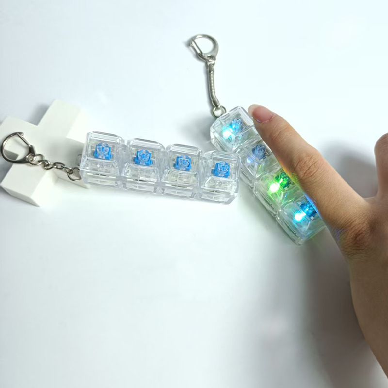 Cuatro botones transparentes puros botones de descarga de llaves luminosas colgantes de llaves transfronterizos cuatro botones en blanco y negro