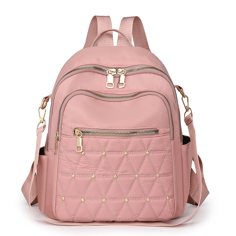 Mochila con remaches bordados de ringge para mujer 2025 nueva bolsa de viaje de moda casual todo-fósforo de gran capacidad para mujer