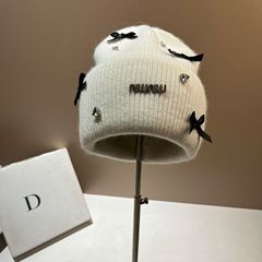 冬のウサギの毛のニットの帽子の蝶結びのドリルのファッションmin保温の毛糸の帽子はロシアの耳の帽子の女性を輸出します。