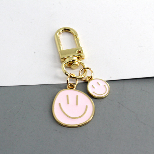 European and American cross-border new cartoon smiley face keychain fashion dripping oil color large and small smiley face pendant girl heart pendant