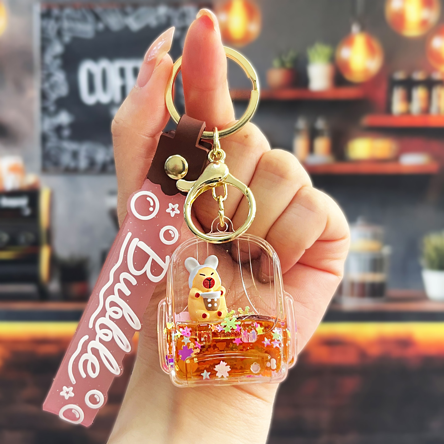 Nuevo aceitoso arena movediza taza de té con leche llavero colgante lindo divertido Kapibala llavero flotante pequeño regalo al por mayor