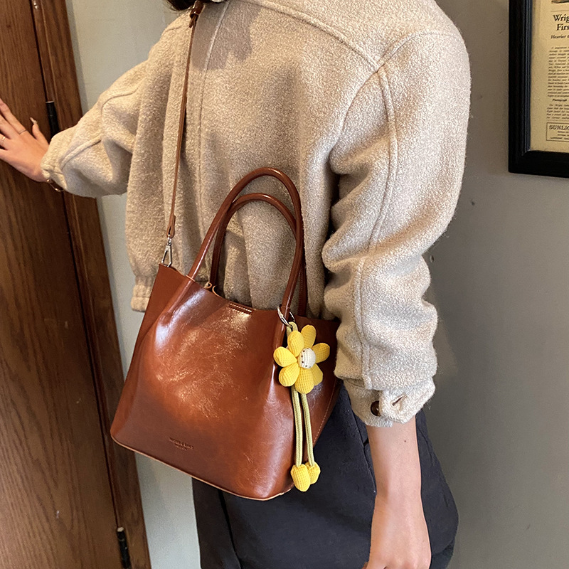 Nicho Zhong canasta de verduras de alto nivel, bolso de cubo, mujer 2025 nuevo retro bolso de trabajo, mochila de viaje