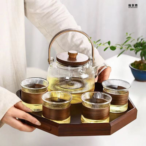 High temperature resistant flower teapot set fruit boiling teapot household steaming integrated wooden handle glass vertical pattern teapot