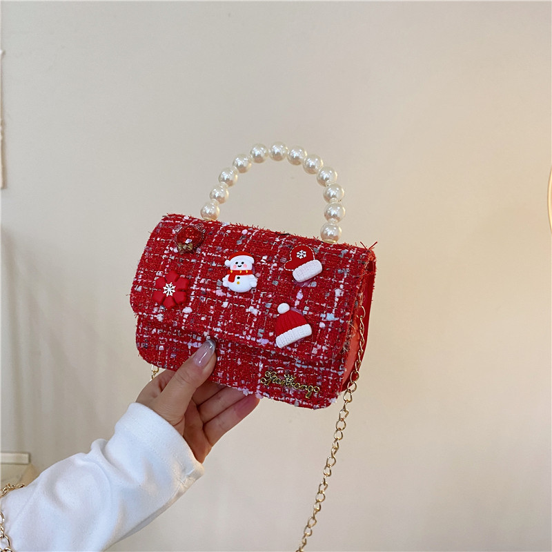 Mini moda para niñas bolso de cambio de perlas 2024 nuevo patrón de moda coreana bolso de ropa infantil