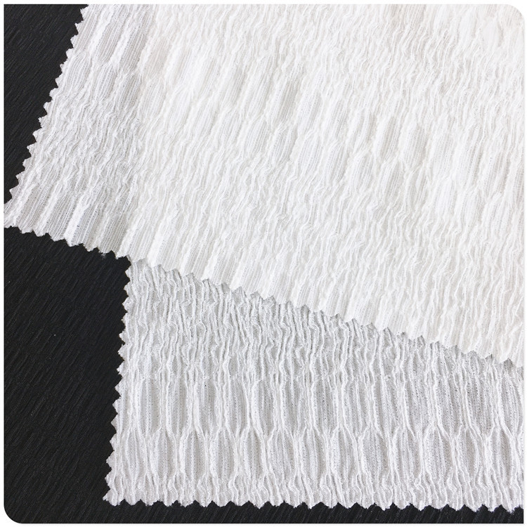 厂家供应编交织花式泡花绉布花纹花式树皮纹泡花绉布女春夏装新