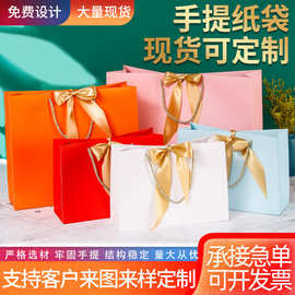 现货白卡纸礼品袋蝴蝶结手提纸袋服装店购物袋厂家批发可印logo