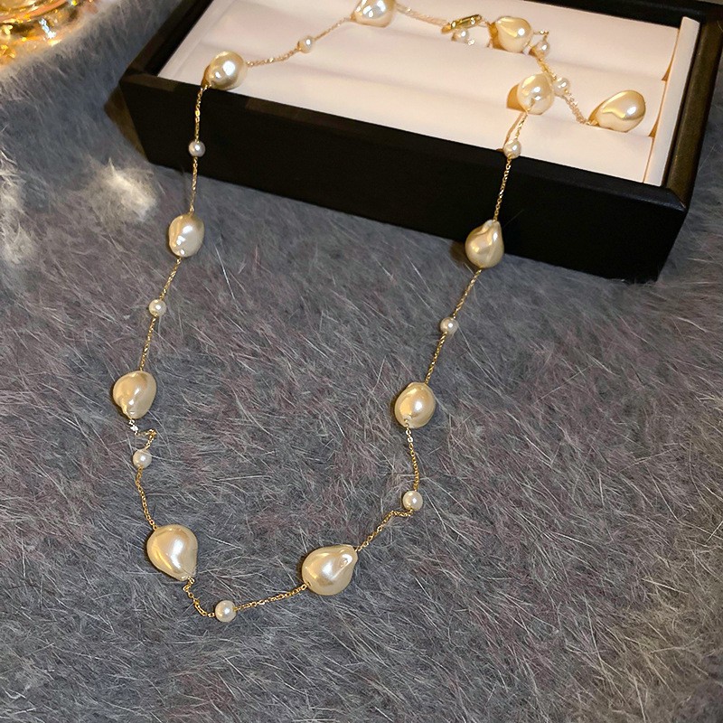 Collar con cuentas de perlas de gota de agua con diamantes transfronterizos otoño e invierno cadena de suéter de lujo ligero francés moda todo fósforo joyería de alta gama