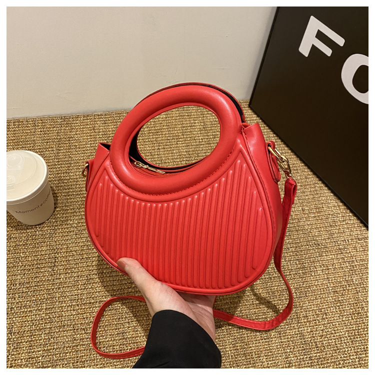 Fresco dulce dopamina color sólido rayas bolso de las mujeres este año popular pu estilo occidental bolso de hombro redondo