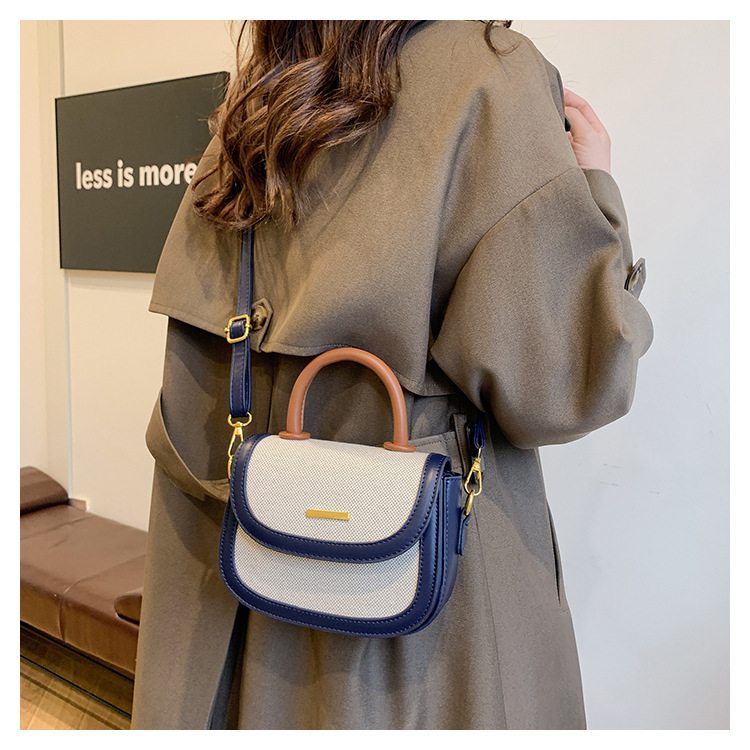 Bolsos de silla de mano de alta textura para mujeres 2026 nueva moda transfronteriza retro color contrastante empalme mochila de hombro