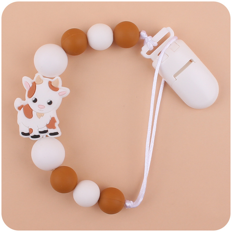 Nuevo bebé suministros chupete cadena creativa de dibujos animados Cordero silicona bebé mordedura cadena anti-gota molar