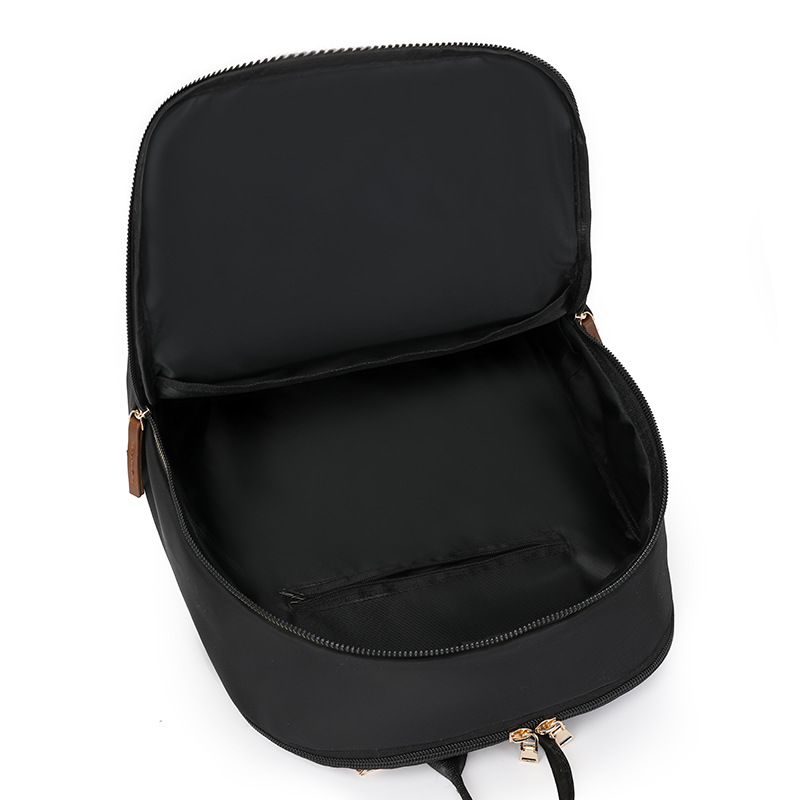 Comercio exterior al por mayor 2025 nueva mochila de nailon para mujer de color de contraste, mochila de computadora de gran capacidad anti-salpicaduras