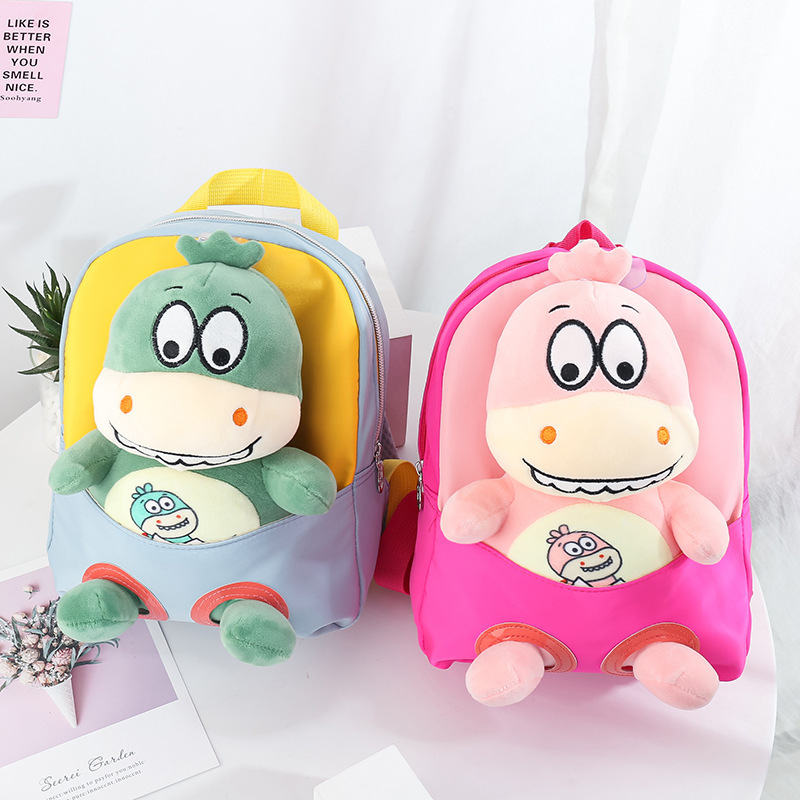 Fábrica de stock nuevo mochila infantil de dibujos animados muñecas de peluche dinosaurios desmontables mochila de jardín de infantes comercio exterior