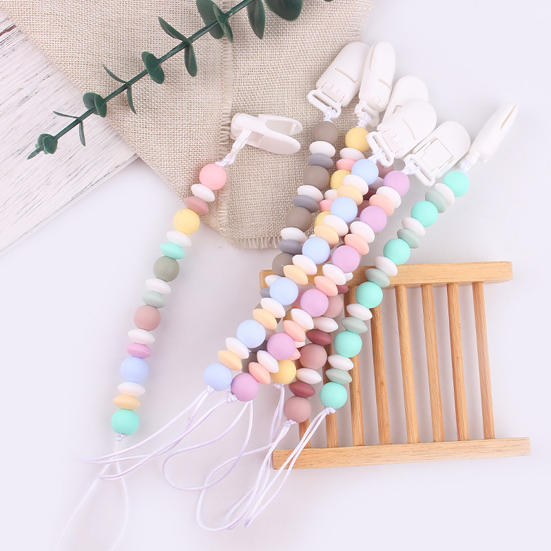 Nuevos productos para bebés cadena de tetas para calmar al bebé dibujos animados DIY color silicona mordida cadena de tetas cadena anti-caída cadena