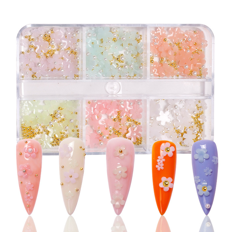 Manicura de estilo japonés joyería de flores de cinco pétalos joyería de flores pequeñas tridimensionales que cambian la luz Internet celebridad resina accesorios de uñas de flores de cinco pétalos