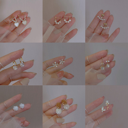 Simple temperament and compact S925 silver needle niche high-end pearl inlaid diamond love earrings small earrings for women wholesale