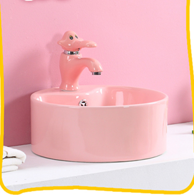 Lavabo de color para niños de jardín de infantes lavabo de cerámica tamaño pequeño lavabo para niños mesa redonda lavabo fabricante