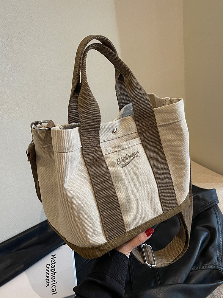 Bolso de hombro para mujer de nicho nuevo para otoño 2023, estilo coreano de internet, bolso de lona casual de mano, bandolera versátil para estudiantes