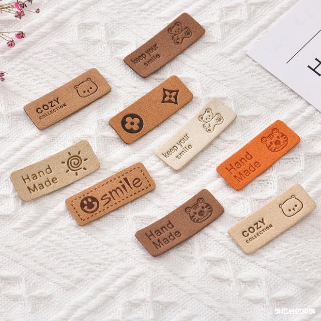 手工DIY毛线玩偶包包装饰皮标压花笑脸兔子图案皮革服装鞋包织唛