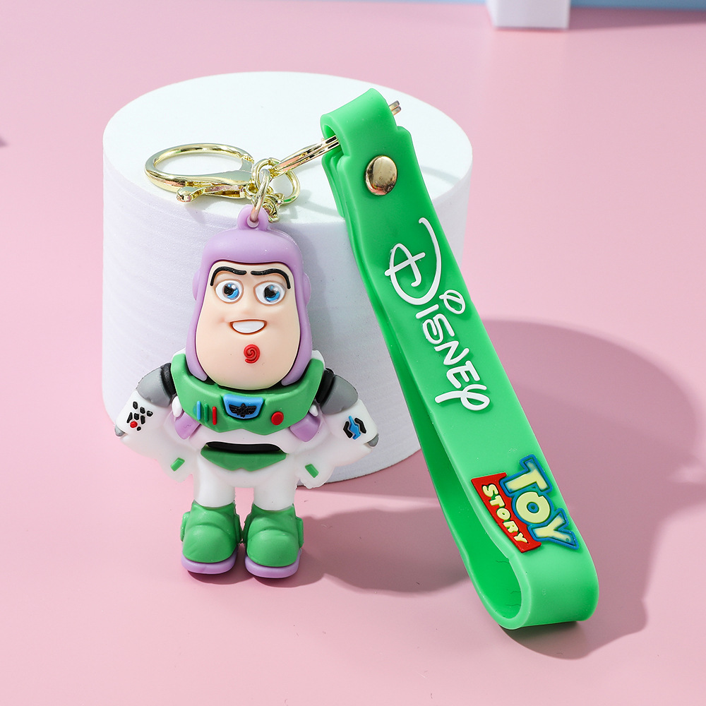 Llavero de silicona de Toy Story, el popular dibujo animado, con personajes como el alienígena de tres ojos, Buzz Lightyear y el oso Lotso, ideal como adorno para bolso.