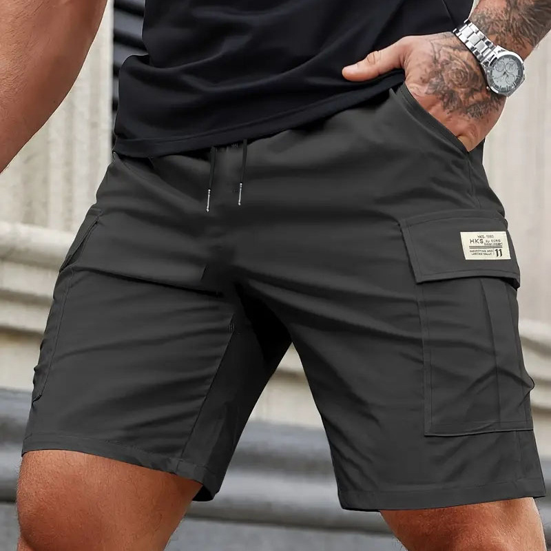 Pantalones cortos de trabajo de verano transfronterizos para hombres sueltos, secado rápido, pantalones casuales de cinco centavos de tamaño europeo, pantalones de bolsillo recto resistentes al desgaste