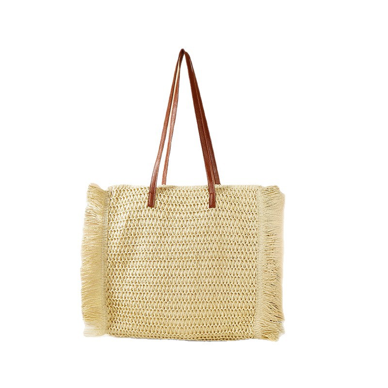 Verano nuevo estilo borla bolso de paja de un solo hombro bolso tejido de gran capacidad para mujer bolso de playa de vacaciones junto al mar bolso Tote