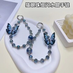 軽くて豪華な携帯のチェーンのひもの細い閃光の猫の目の玉の立体の蝶の高級感の水晶の数珠の手提げの短い金の鎖の女性