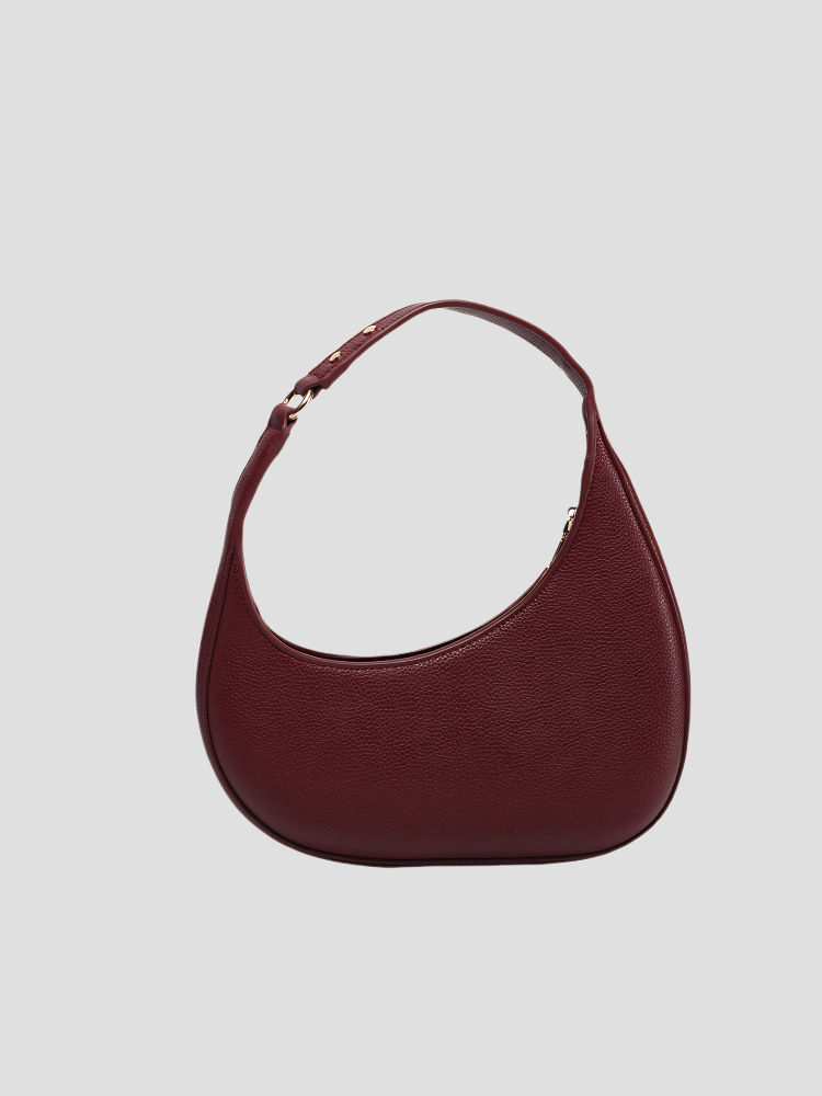 2025 nuevo diseño de nicho de moda europea y americana, bolso de luna creciente irregular en forma de media luna, bolso de axila de alta gama, mujer