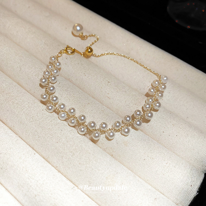 Pulsera tejida de perlas de doble hilera francesa, lujo ligero, pulsera exquisita de moda de alta gama, nueva joyería de todo fósforo, venta al por mayor femenina