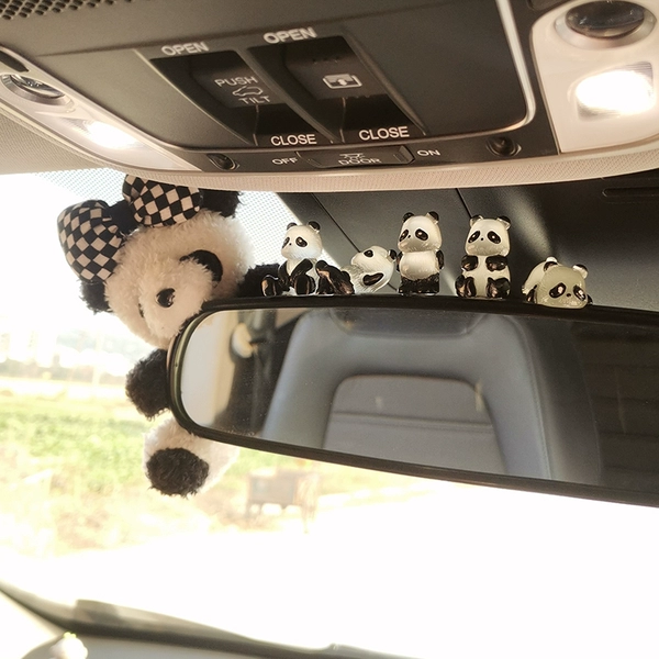 Black and white knotted panda sitting on the rearview mirror + transparent panda