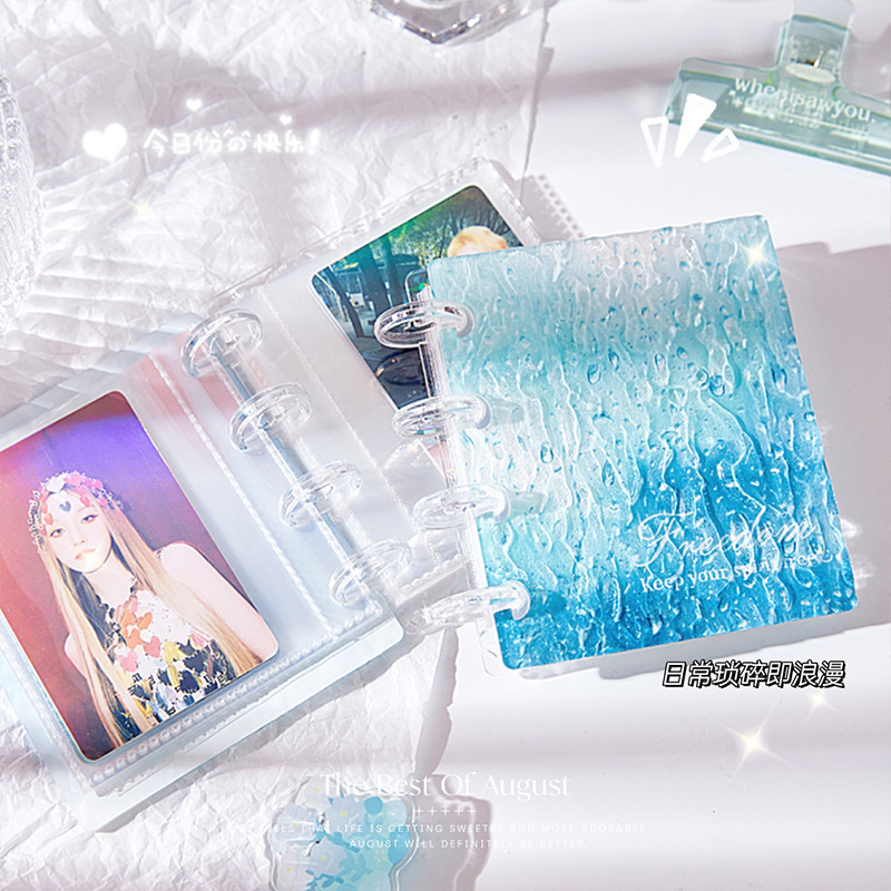 Agua ondulada transparente álbum de tarjetas de las niñas en el viento alto valor de la cara acrílico Bean amor pequeño álbum de tarjetas de almacenamiento álbum de páginas volantes