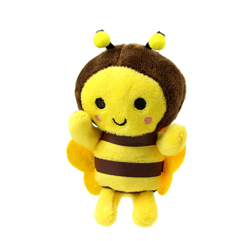 かわいいぬいぐるみの黄色のミツバチのぬいぐるみが祝日のプレゼントのかばんのバックパックに飾られているぬいぐるみ|undefined
