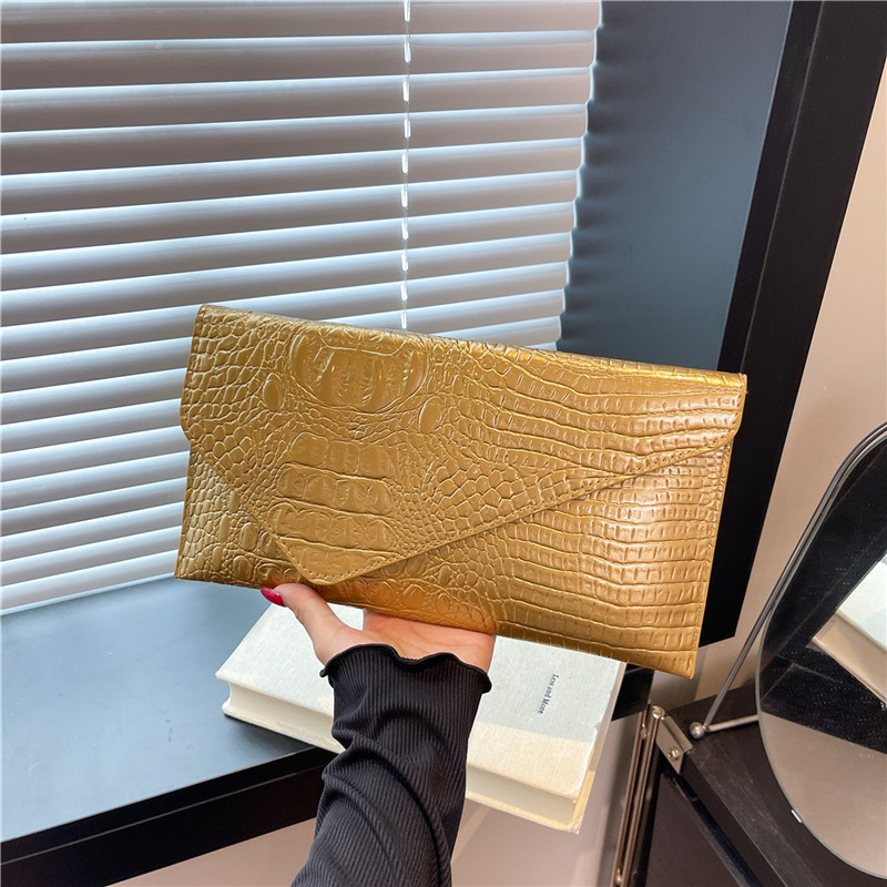 Este año, la popularidad de las mujeres europeas y estadounidenses retro cocodrilo piel impresión bolso de mano larga alta sensación casual multifuncional cartera de cena
