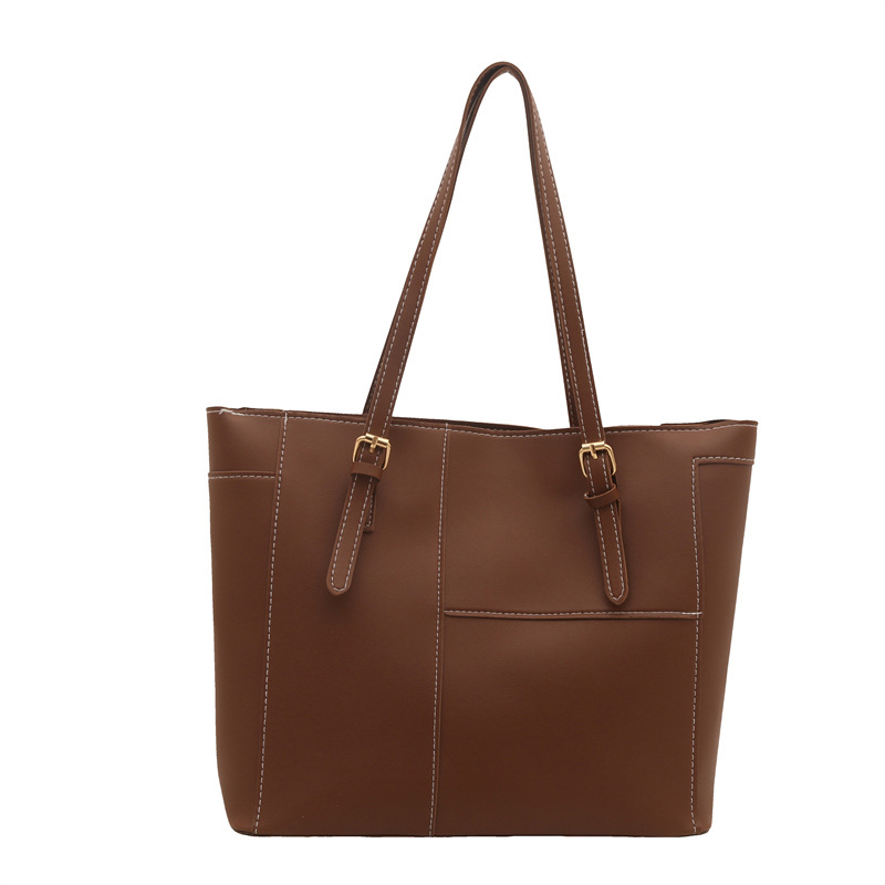 Bolsa de mujer de gran capacidad de textura de viaje de primavera 2025, nuevo bolso de hombro retro empalmado bolso de brazo portátil