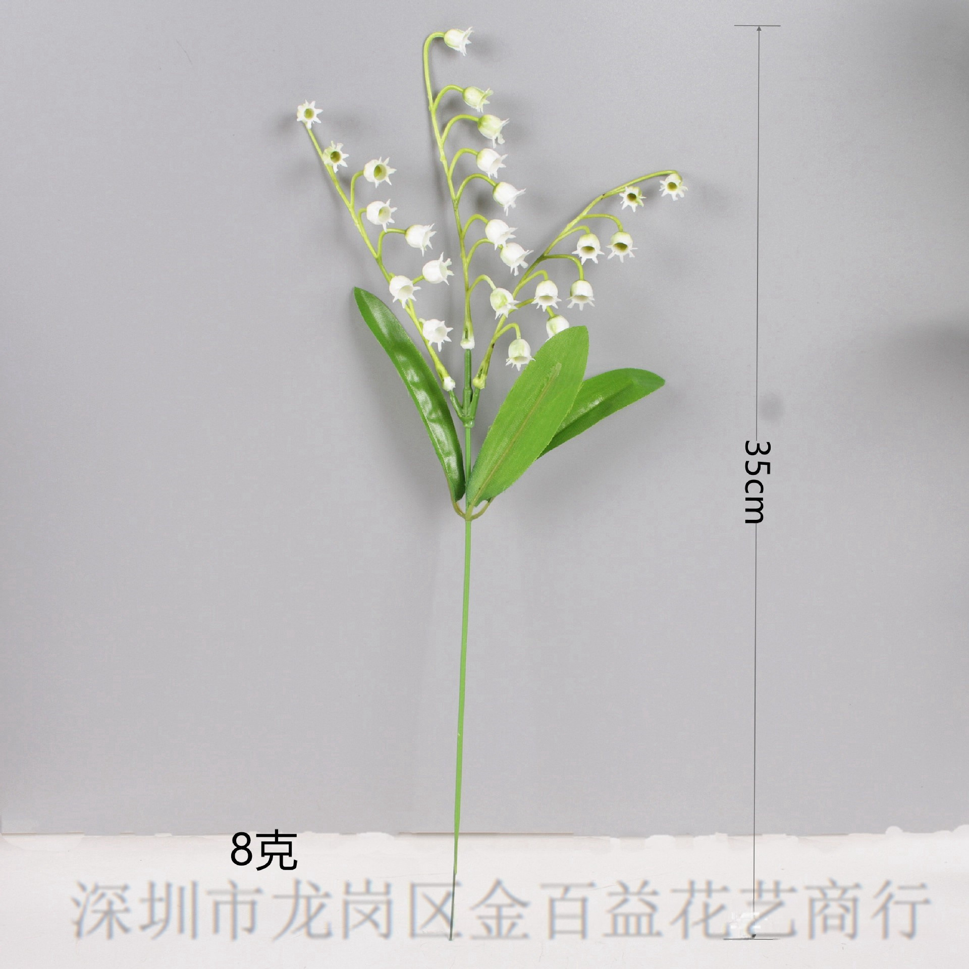 El viento del interior sostiene un ramo de lirio de los valles, flores artificiales frescas, flores de plástico blancas, mesa de comedor, flores falsas, flores decorativas, flores