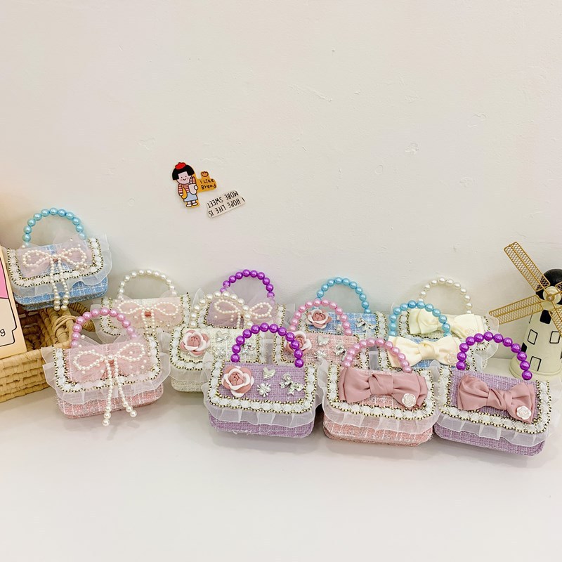 Niña tween pequeña bolsa de hombro arco encantadora princesa mochila de perlas de aire extranjero para niños bolsos lotes