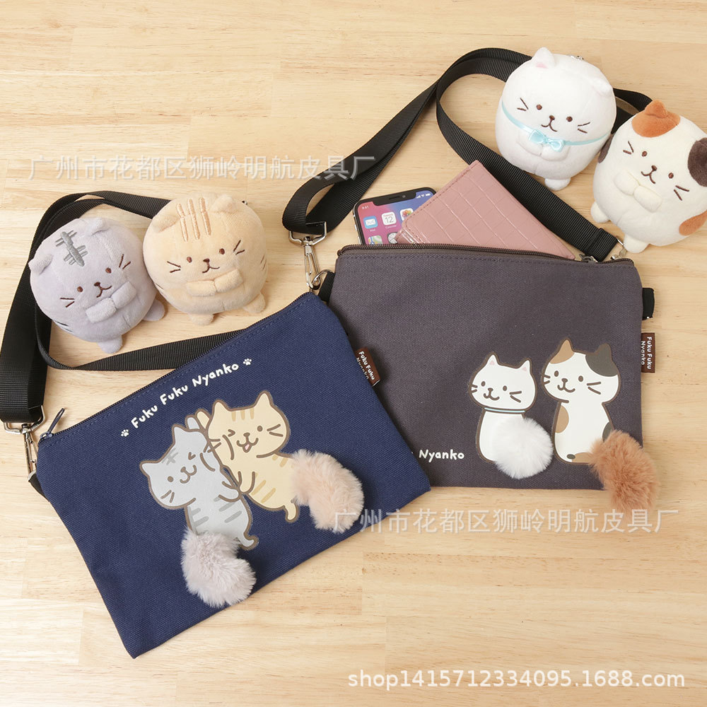 日系新款猫咪斜挎包可爱卡通带猫咪尾巴单肩斜跨小包随身小包