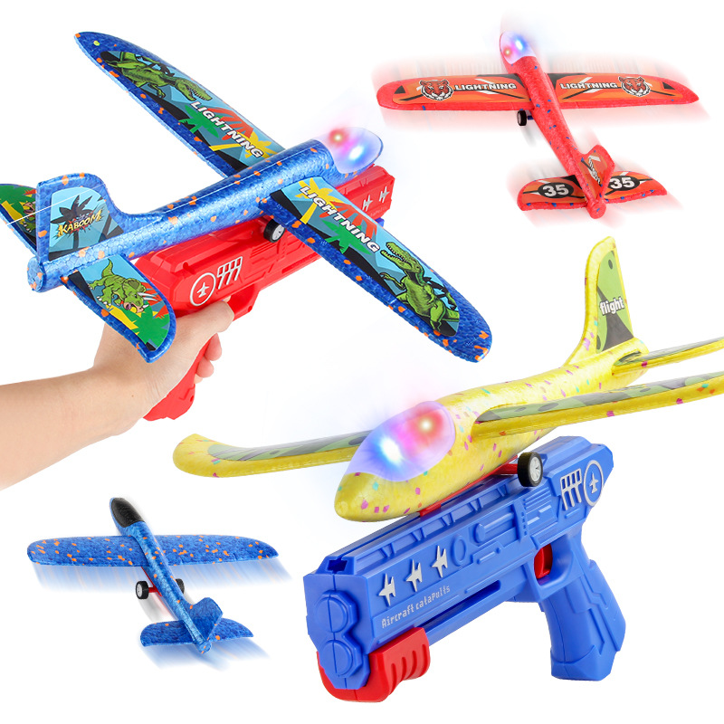 Tiktok Venta caliente espuma luminosa Catapulta Aviones pistola lanzador de mano planeador juguetes para niños al aire libre puesto juguetes del mercado nocturno