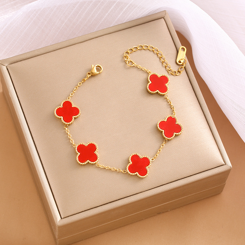 Pulsera de trébol de acero titanium vendedora caliente transfronteriza europea y americana con incrustaciones de concha pulsera colgante pulsera de diseño avanzado sin desvanecimiento al por mayor